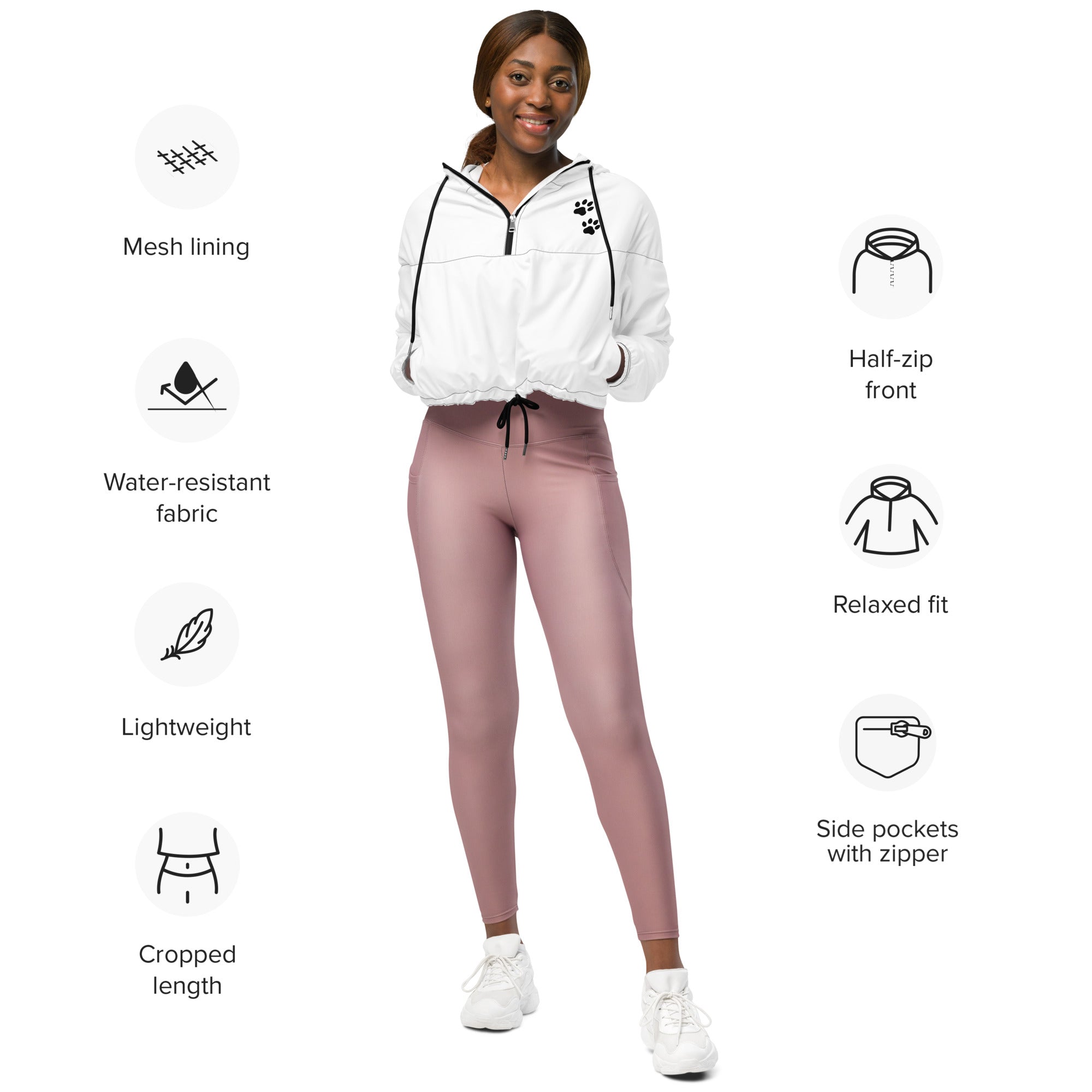 Woman wearing a white jacket and pink leggings with feature icons on a white background