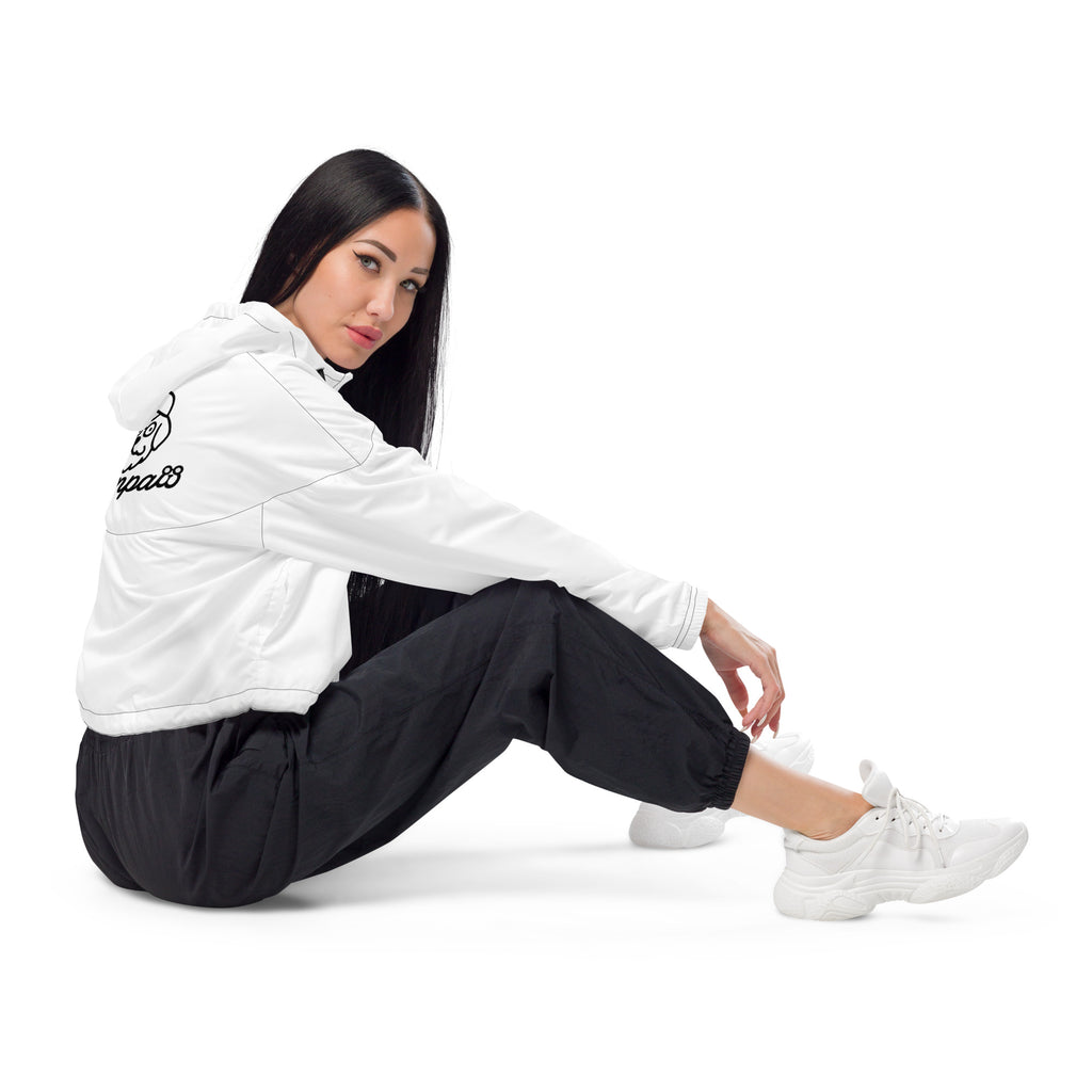 Person wearing a white granpaw golf hoodie with a logo and black pants sitting on a white background