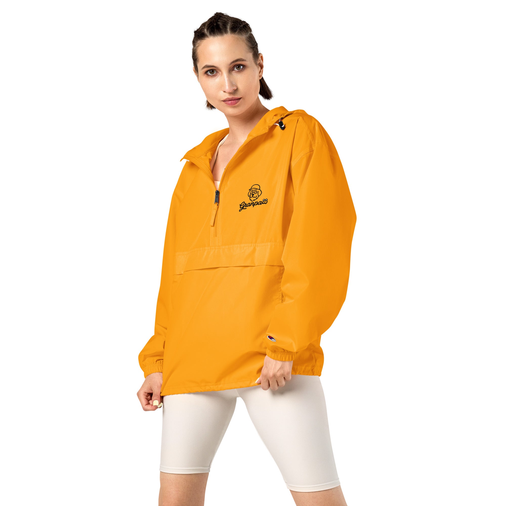 Woman wearing a yellow jacket with a brand logo on a white background
