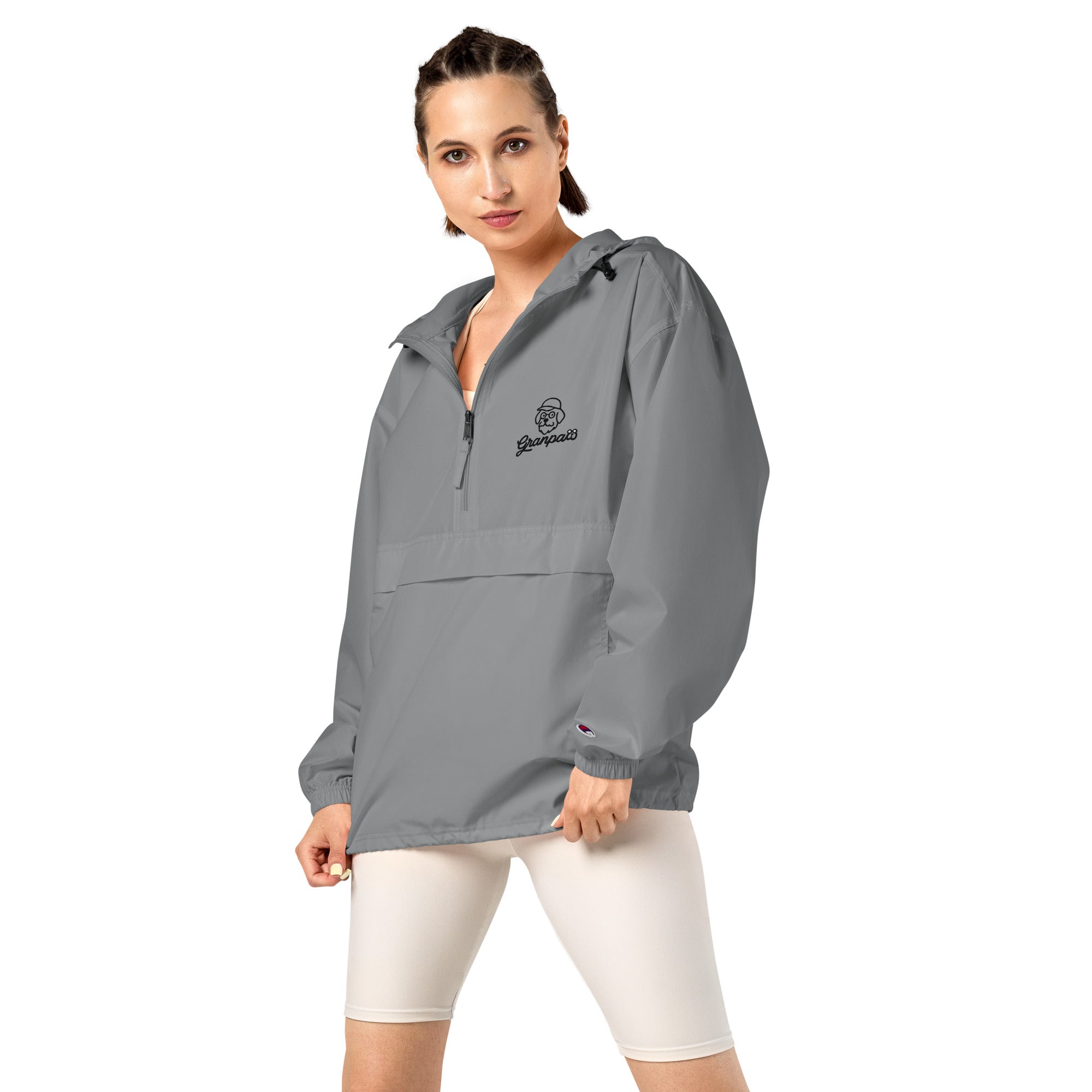 Woman wearing a gray jacket with a logo on a white background