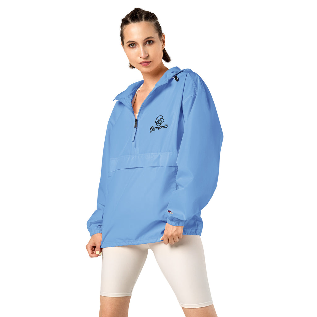 Woman wearing a blue jacket with a logo on a white background