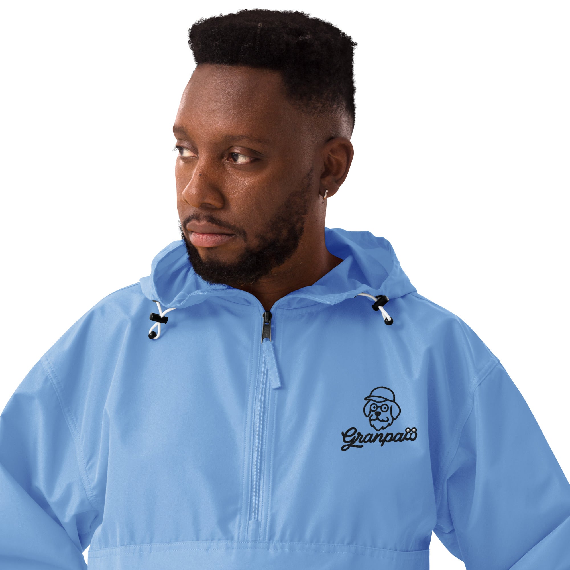 Man wearing a blue jacket with a logo on a white background