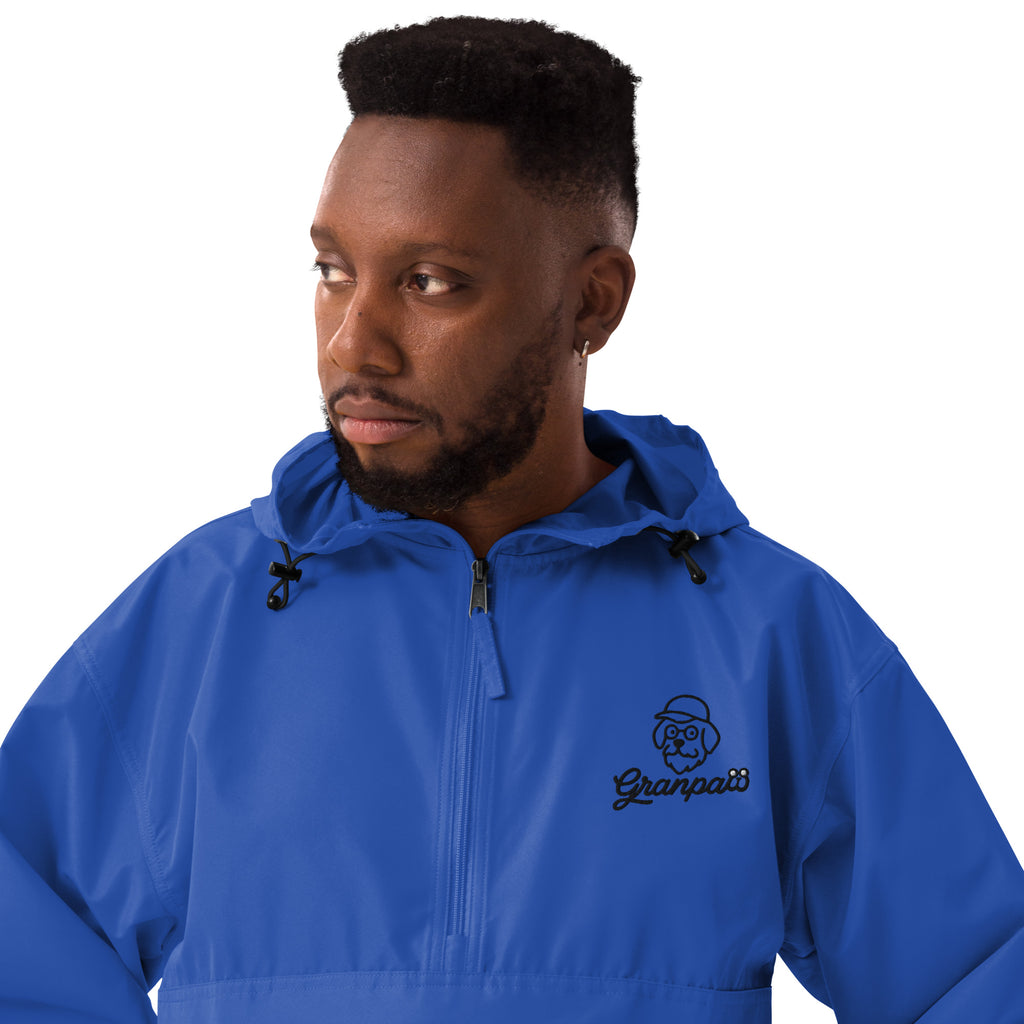 Man wearing a blue jacket with a brand logo on a white background
