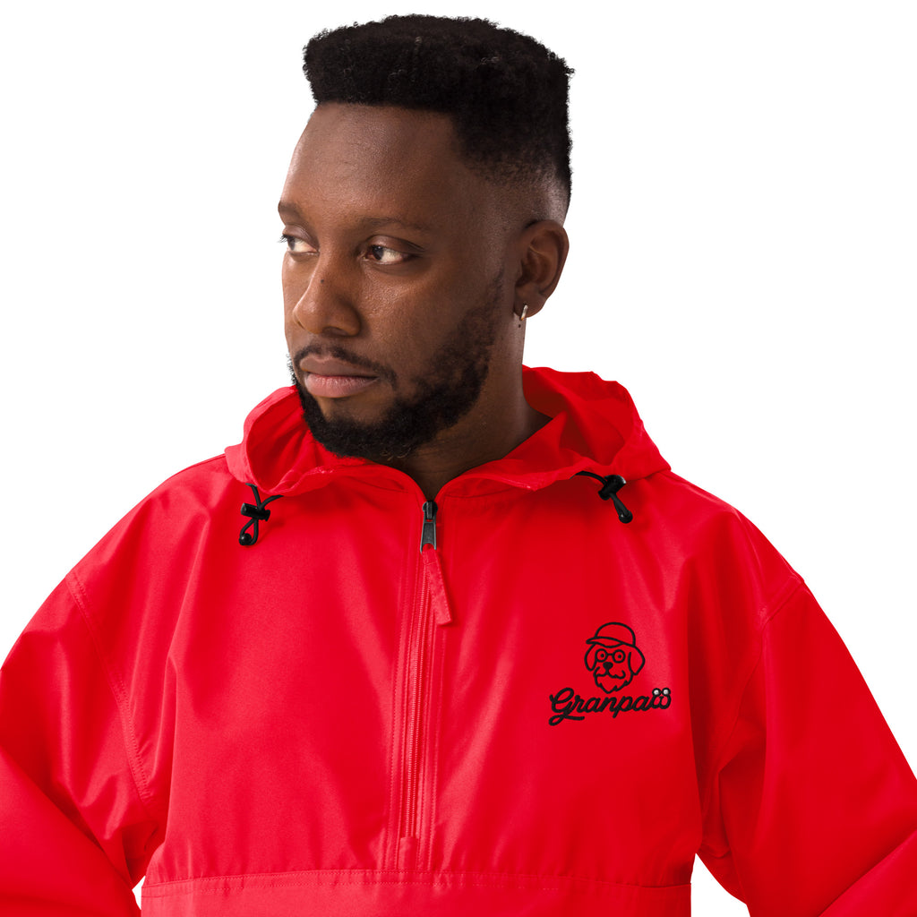 Man wearing a red jacket with a brand logo on a white background