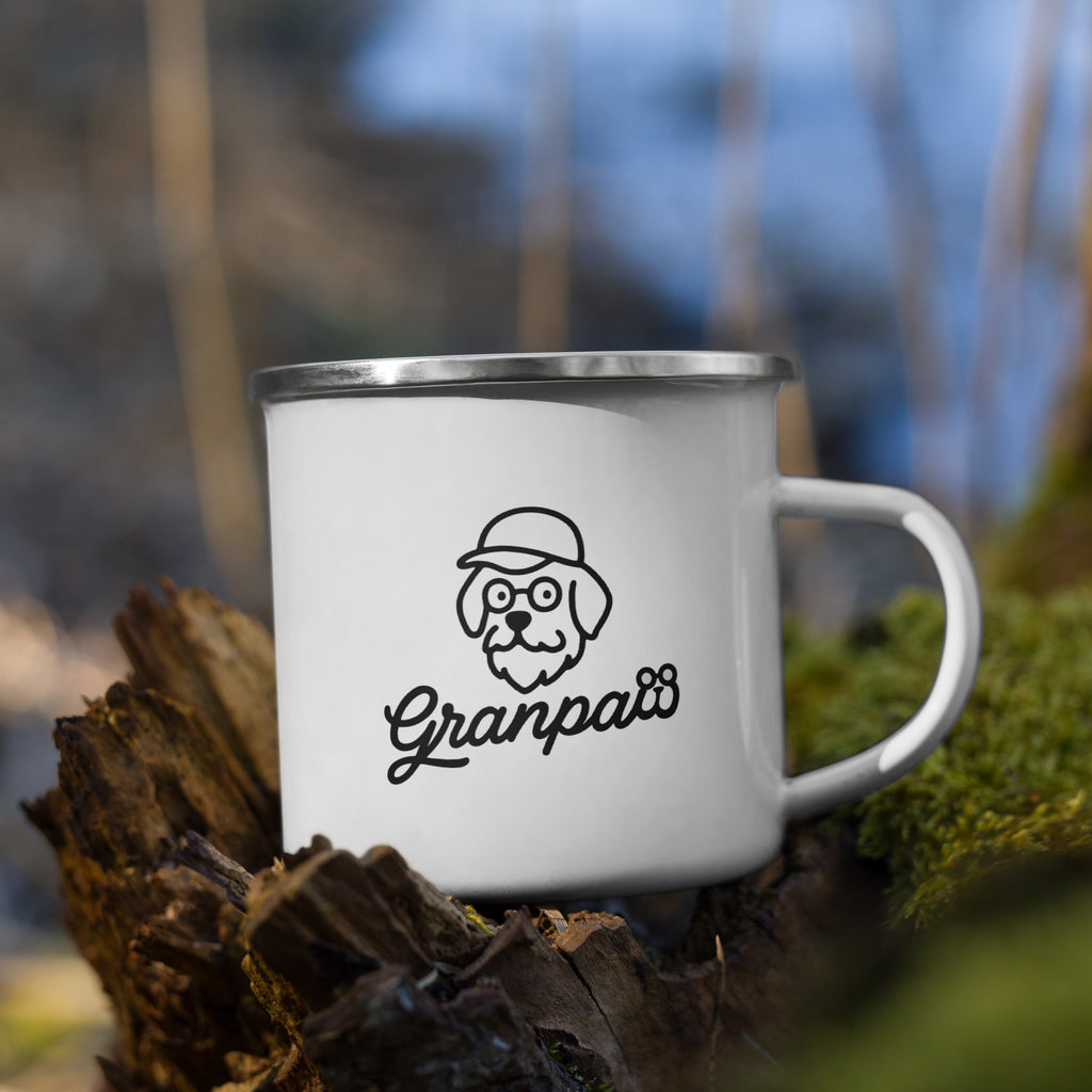 White mug with 'Granpaw' design on a log with a blurred natural background