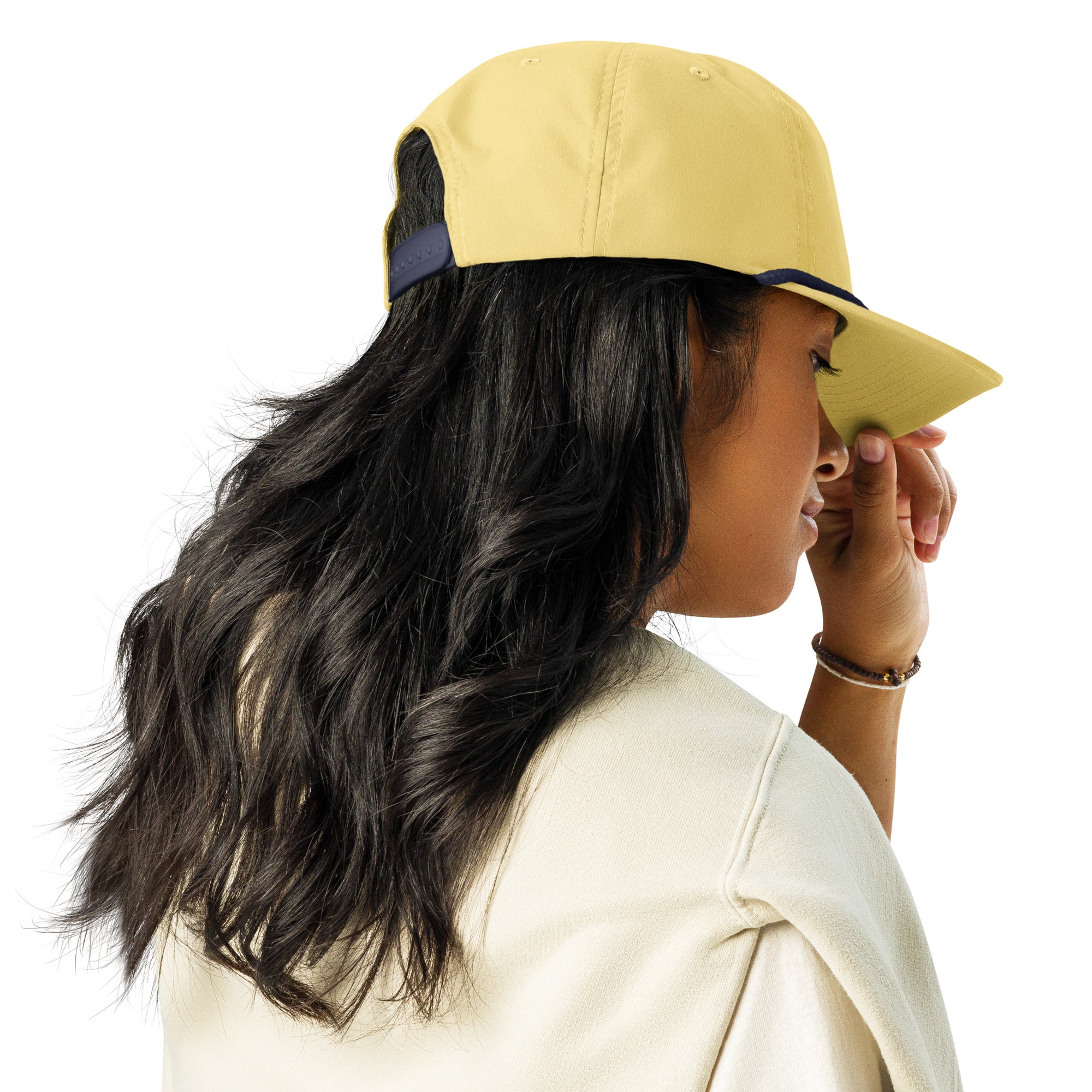 Person wearing a yellow cap on a white background