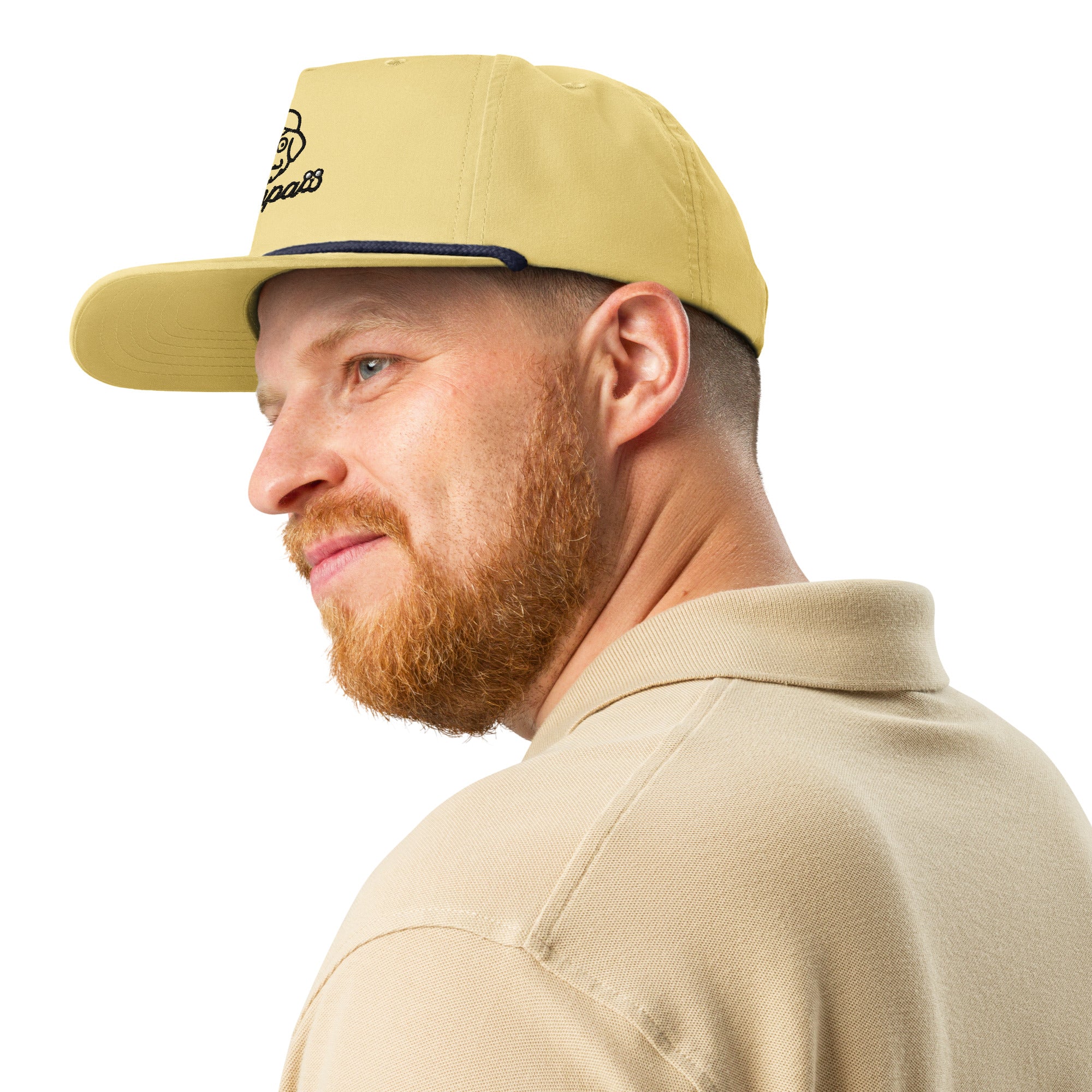 Man wearing a beige cap and matching polo shirt on a white background