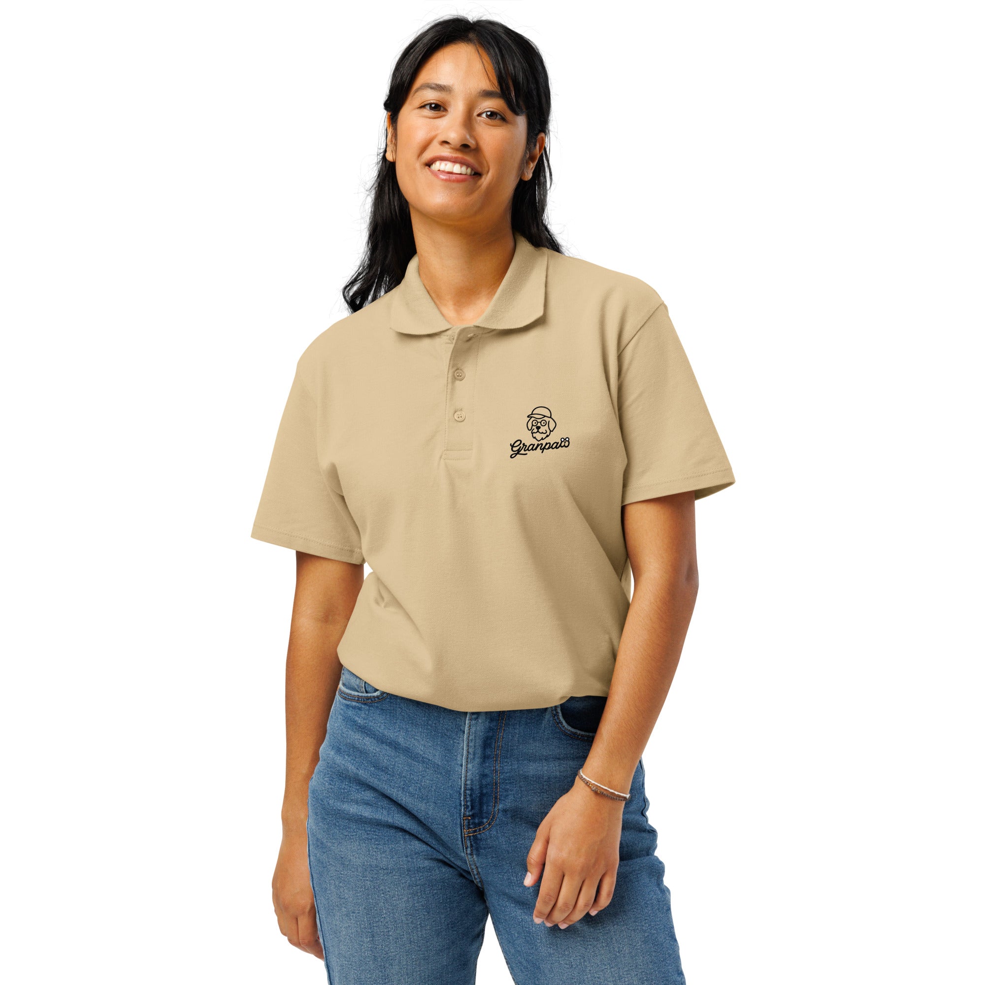 Woman wearing a beige polo shirt with a logo on a white background