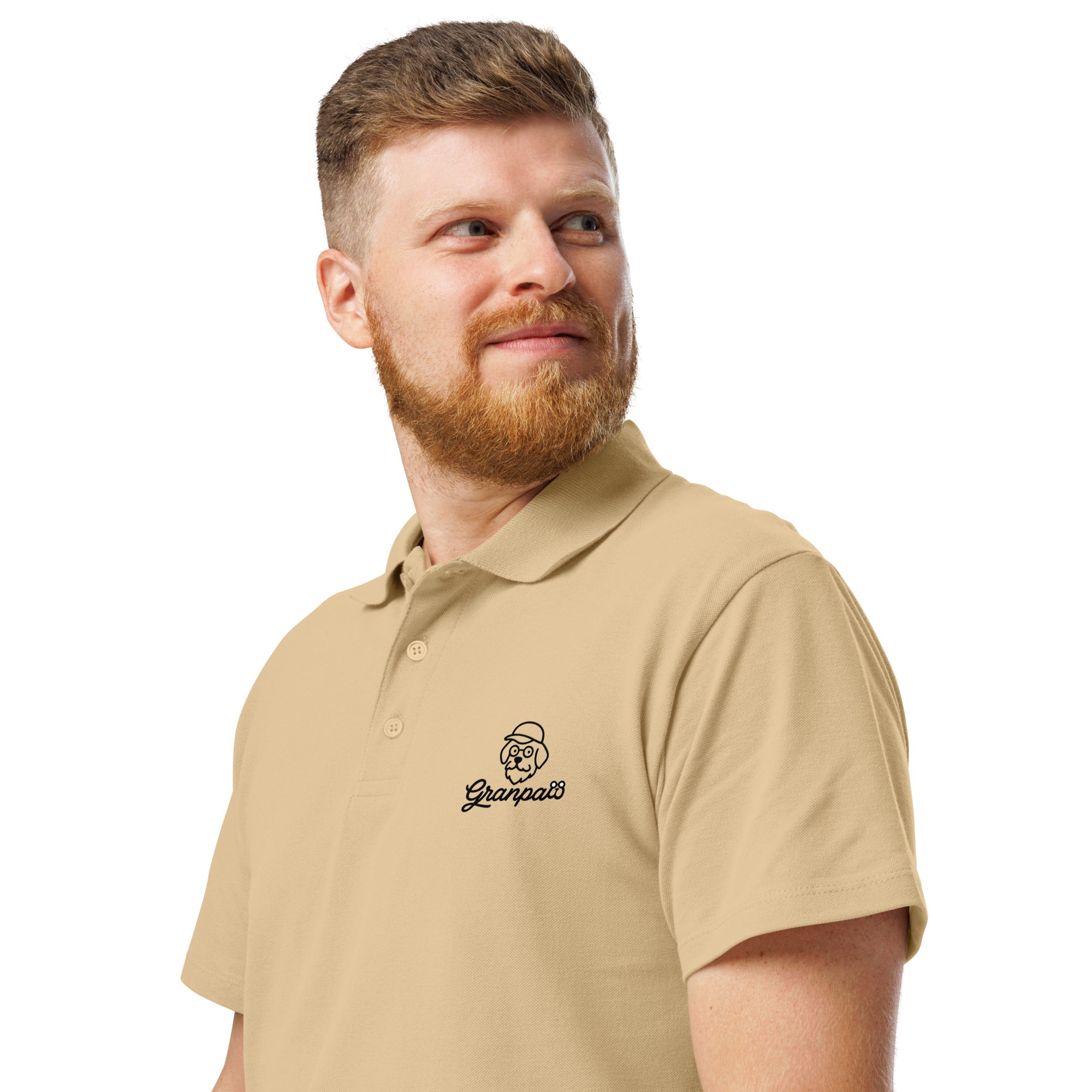 Man wearing a beige polo shirt with a logo on a white background