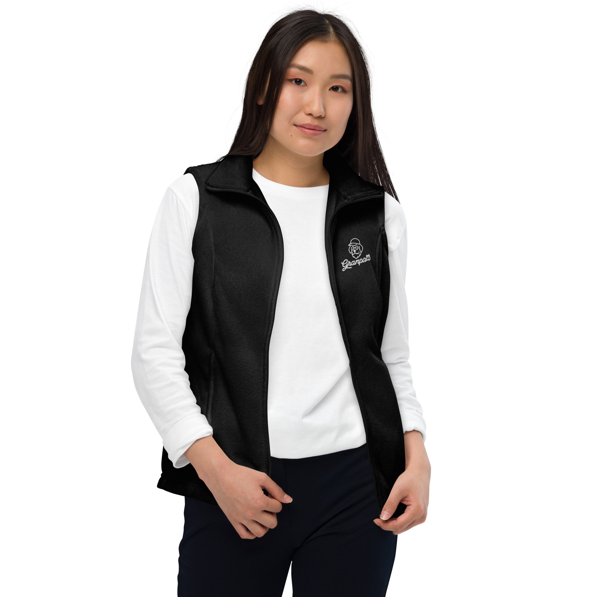 Person wearing a black vest over a white long-sleeve shirt on a white background