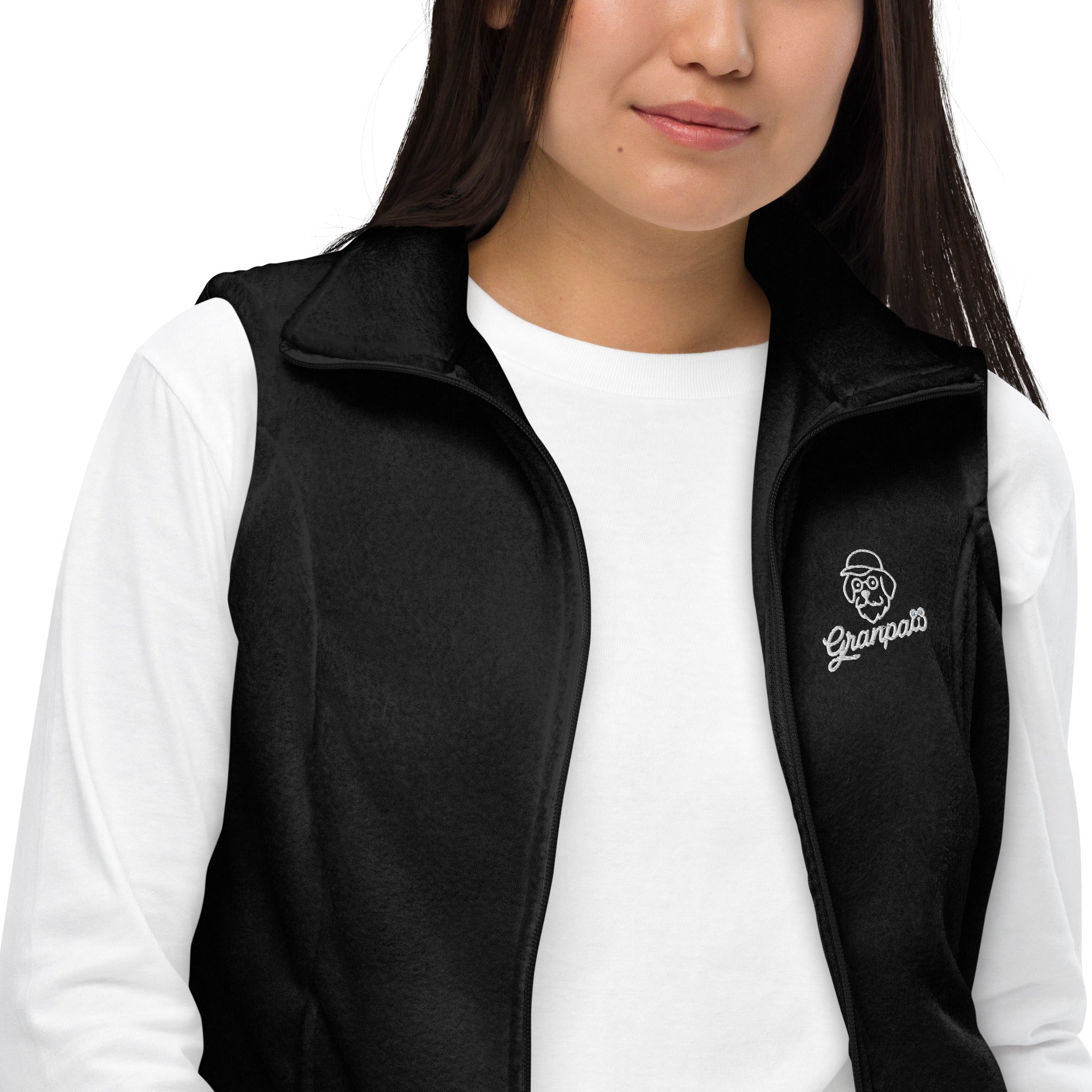 Person wearing a black vest with a logo on a white background